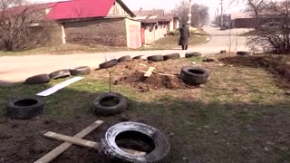 'It could have been me': woman in Mariupol buries stepfather