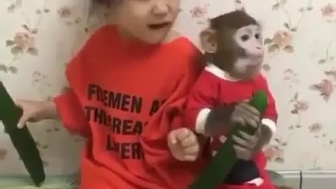 Cute little girl and monkey pet