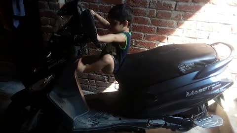 Cute baby scooty rider