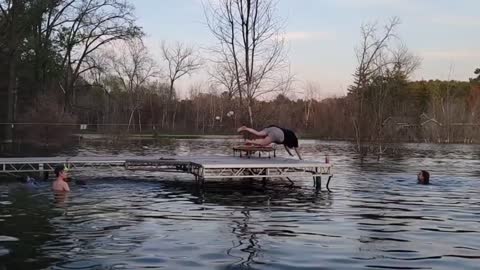 Grandma Jumps Off Trampoline Kept on Dock's Edge and Falls Awkwardly into Water