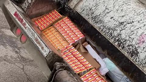 Crushing Milk in a Garbage Truck Compactor