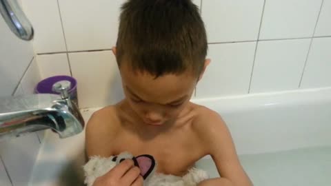 Sensitive Boy Bathes His Teddy Bear