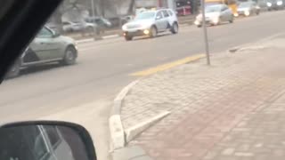 Taxi Takes Off with Passenger on the Hood