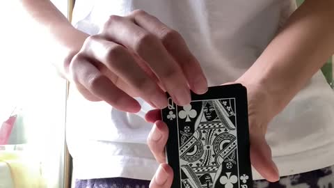 Video of a young boy practicing card magic