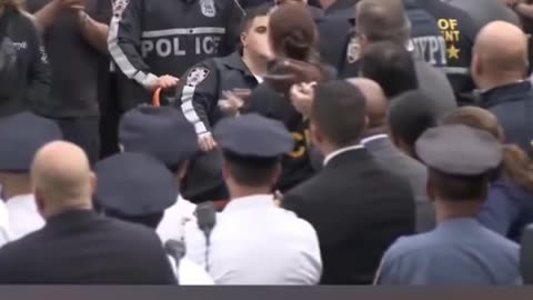 NYPD officers injured in shooting receive applause after release from hospital