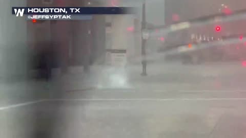 Heavy rain in Houston is causing flooding and water to come through manhole covers!