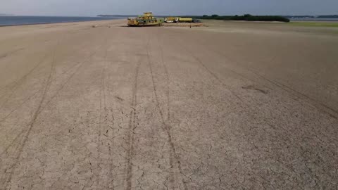 Tugboat, barge stranded amid Amazon drought