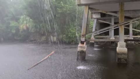 Pontoon in a storm under a bridge. Crystal river, Florida