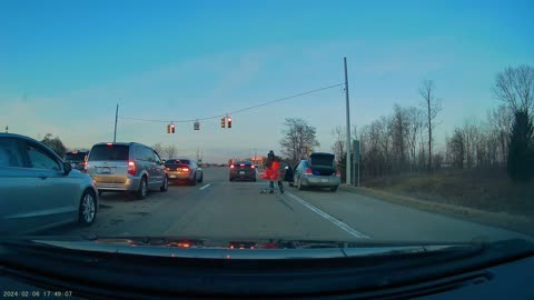 Man Unloads Shopping Cart From Road Shoulder