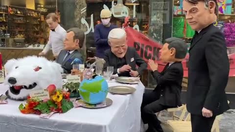 Protesters serve fake world leaders the dramatic effects of climate change on a plate
