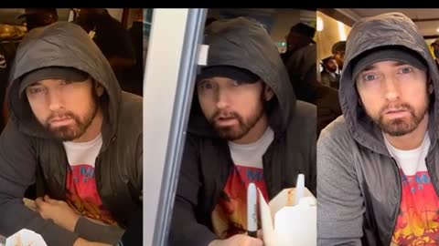 Surprise! Eminem serves fans at food window of Mom’s Spaghetti restaurant Detroit opening.