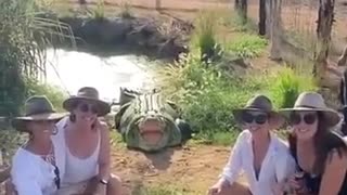 Australian women take a photo with a crocodile and get scared