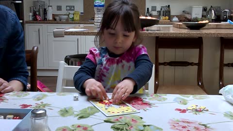 Freya playing board game with Grandma