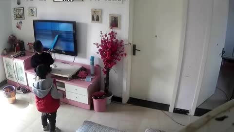KERPOW! Boy smashes TV with brush as he tries to help on-screen superhero