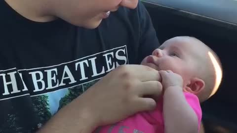 Daddy sings to his daughter