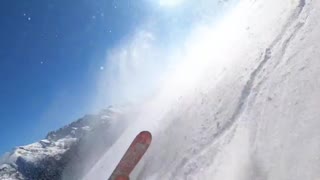 Skier Slides in Free-Fall Down Icy Slope