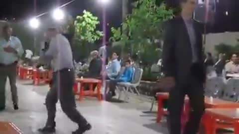 Old man dancing in a wedding party