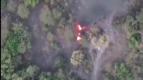 Drone footage shows forest burning after rocket attack by cartel
