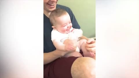 This baby is having so much fun with a piece of paper! 😍