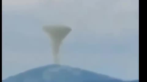 UFO over volcano eruption