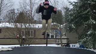 Brown pants jacket man front flips off trampoline