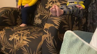 Boy Slides off Side of Chair