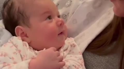 Lovely baby talking to mom in his style