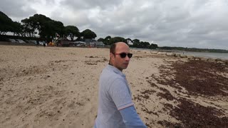 Practice using the Go pro on a selfie stick.on a beach