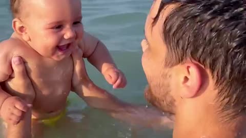 Beachgoing Baby Belly Laughing