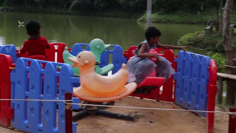 Little child/kid playing funny moment in lake park