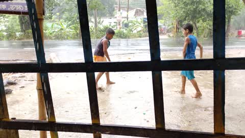 Kids Playing In Rain in Bangladesh