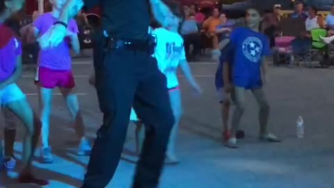 Officer Boogies with Kids at Street Party