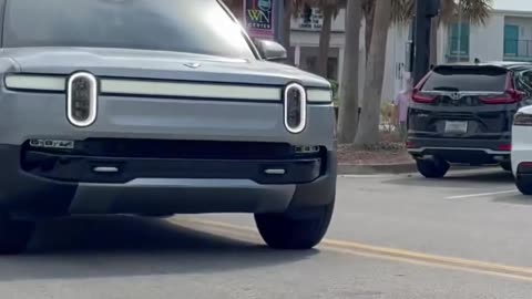 Rivian vs. Chevy: NASCAR-Style Truck Race on the Highway