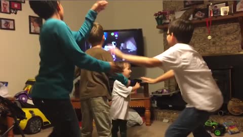 Trio Of Boys Try To Follow Dance Routine On TV