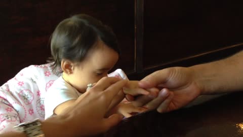 Jealous Baby Girl Keeps Taking Mom’s Hand Away From Dad’s And Replacing It With Her Own