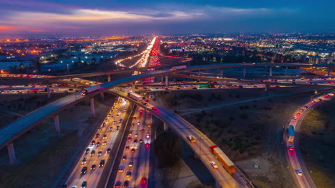 Urban aerial drone time lapse in motion or hyperlapse at night flying