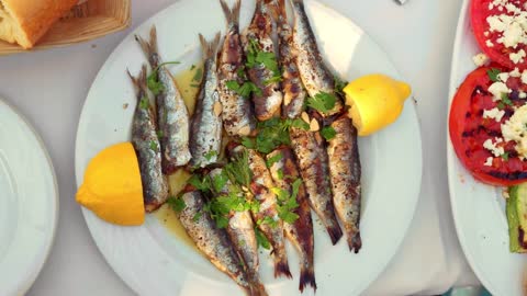 adding lemon to a fish dish