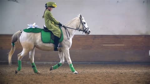 Slow Motion Frog Costume Riding White Horse in Riding Hall