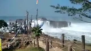 beach waves crashing visitors