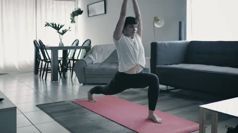Lady practicing yoga at home