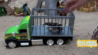 Green Truck with a Cage Transports Lots of Dinosaurs from the Jungle