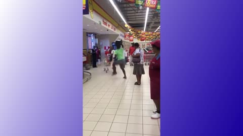 MAN DANCES IN SUPERMARKET
