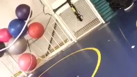 Girl in yellow shirt tries to do front flip on pull ropes and falls forward