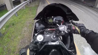 Motorcyclist Walks Away from Highway Tumble