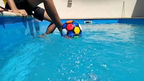 Slow motion ball in swimming pool