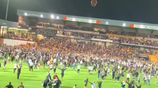 Soccer Fans seize football stadium