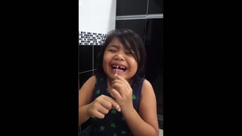 Funny Kids Pulling Teeth Out by herself