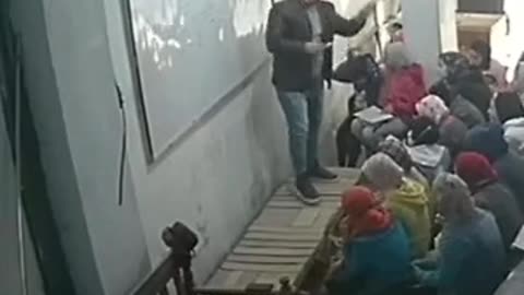 A teacher falls from the top of the sofa And he explains to the students