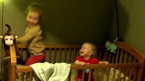 Sibling Giggles - Baby Laughs at Sister Jumping in Crib
