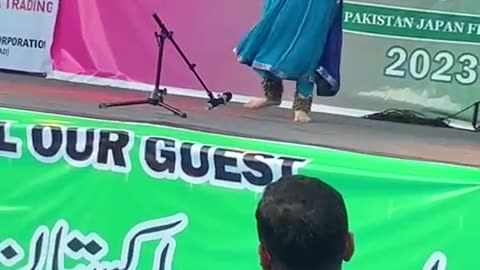 an Indian classical dance performed by a Japanese girl